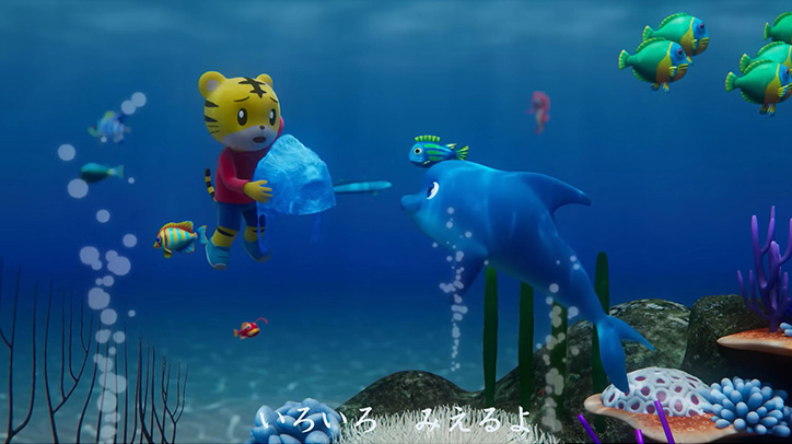 Shimajiro faces a dolphin in the sea.